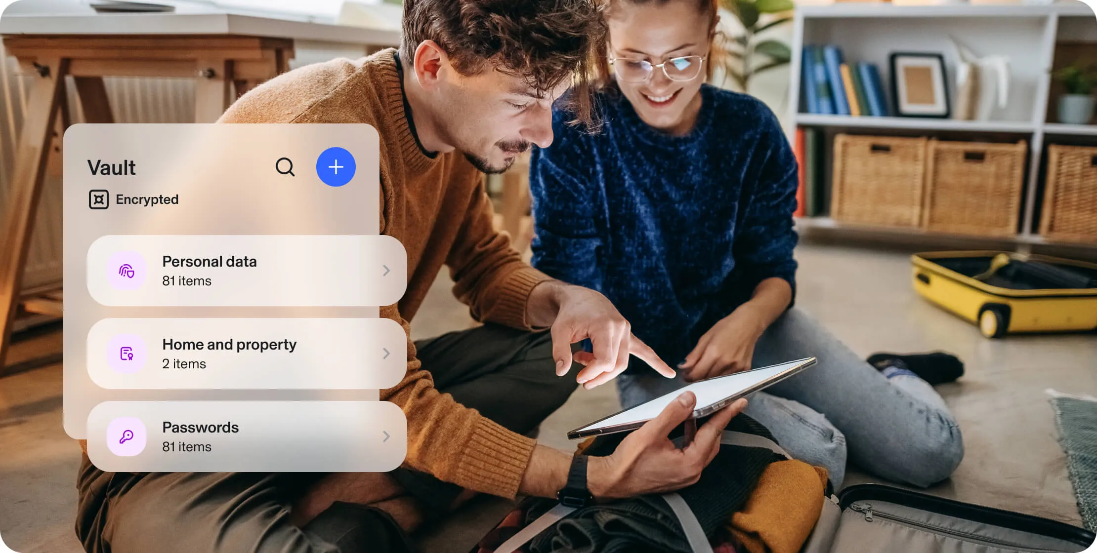 Smiling couple seated on the floor, using a tablet, beside an Aura product popup. Popup: Vault - encrypted. Personal data, 81 items. Home and property, 2 items. Passwords, 81 items.  